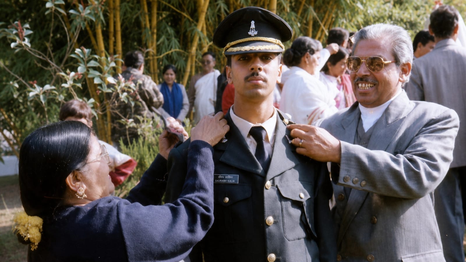 Saurabh Kalia's parents adjust his uniform at his commissioning parade